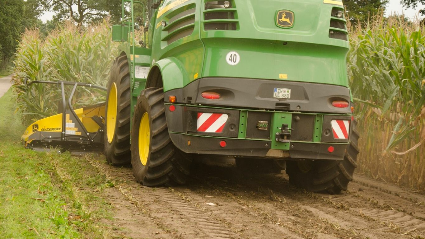 StalkBuster on field attached to a tractor